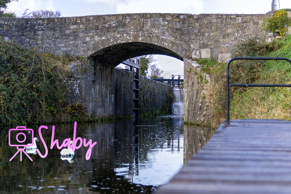 Sunset view from Chambers Bridge over the Royal Canal in Kilcock, County Kildare, featuring reflective waters and lush walkways