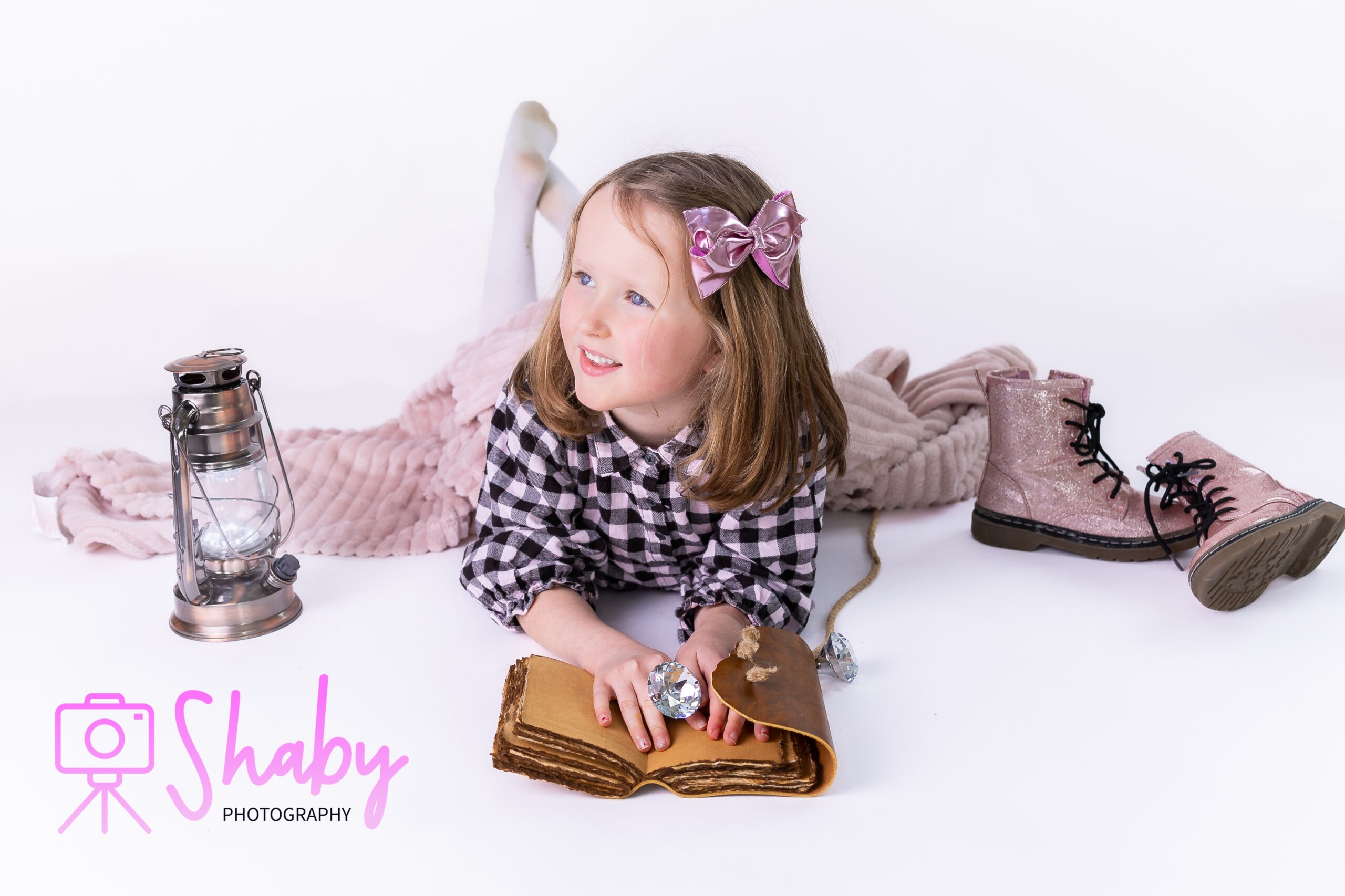 Portrait photography - Unplanned yet perfectly captured studio portrait of sisters Hayley and Willow, sharing a moment of laughter and closeness. Their spontaneous visit shines through in this stunning photo that highlights their natural beauty, happiness, and deep bond. Taken by Shaby.ie a newborn and childrens photographer based in Meath