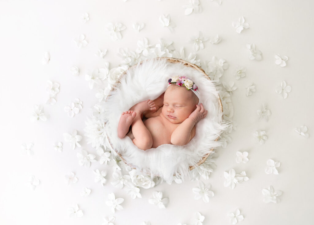 Newborn photoshoot with photo of baby Nora who was a perfect model for her first photoshoot
