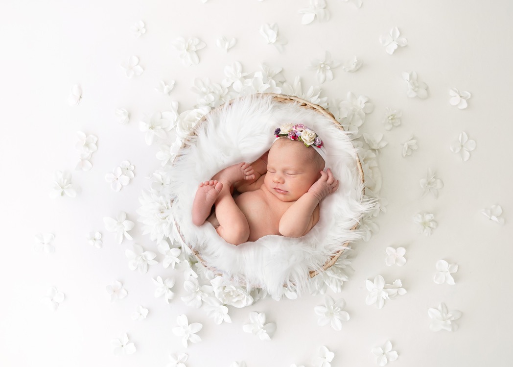 Newborn photoshoot with photo of baby Nora who was a perfect model for her first photoshoot