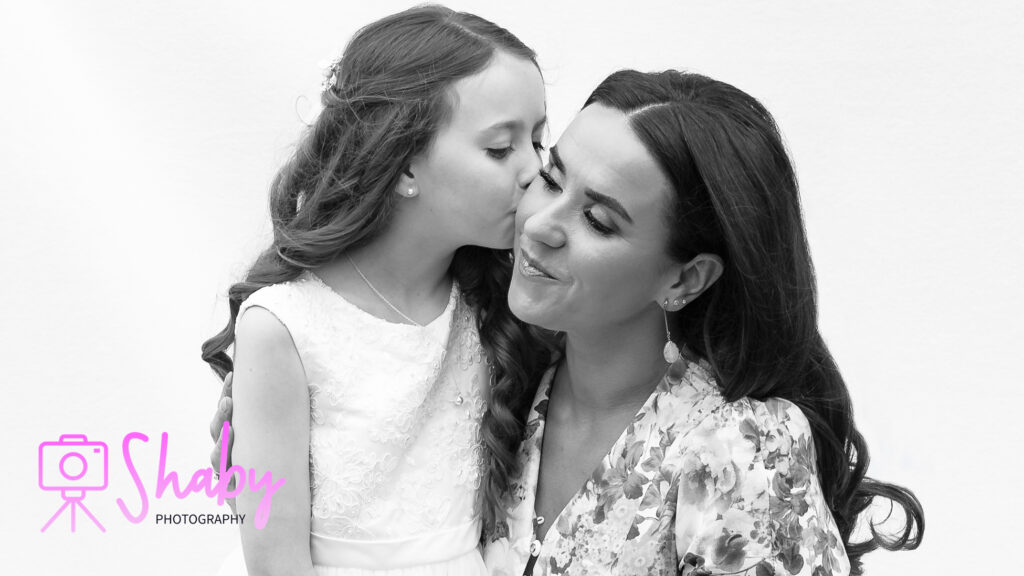 Portrait photography - Image of Hailey's First communion photoshoot, with a beautiful moment between Hailey and her Mother on such a special day, captured forever by Shaby Photography