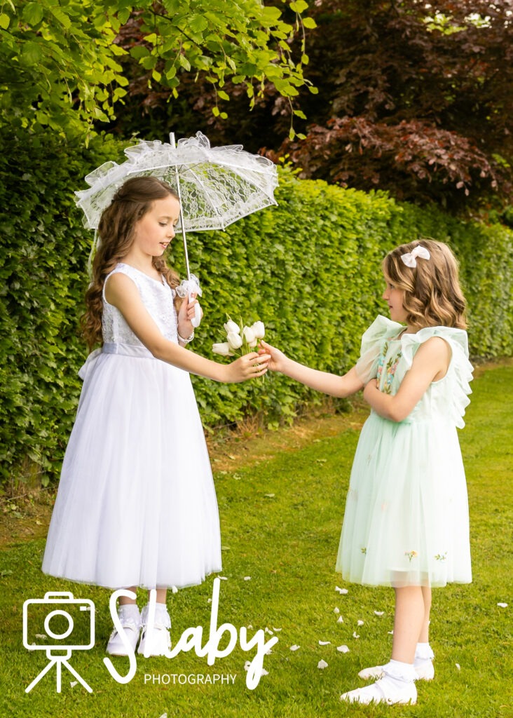 First Communion Photography showing Hailey with her family before the church. Family photoshoot, exclusive photography by Sharon Byrne at www.Shaby.ie