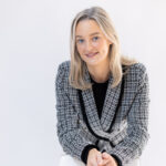 Sarah's professional headshot in a studio setting with soft lighting.