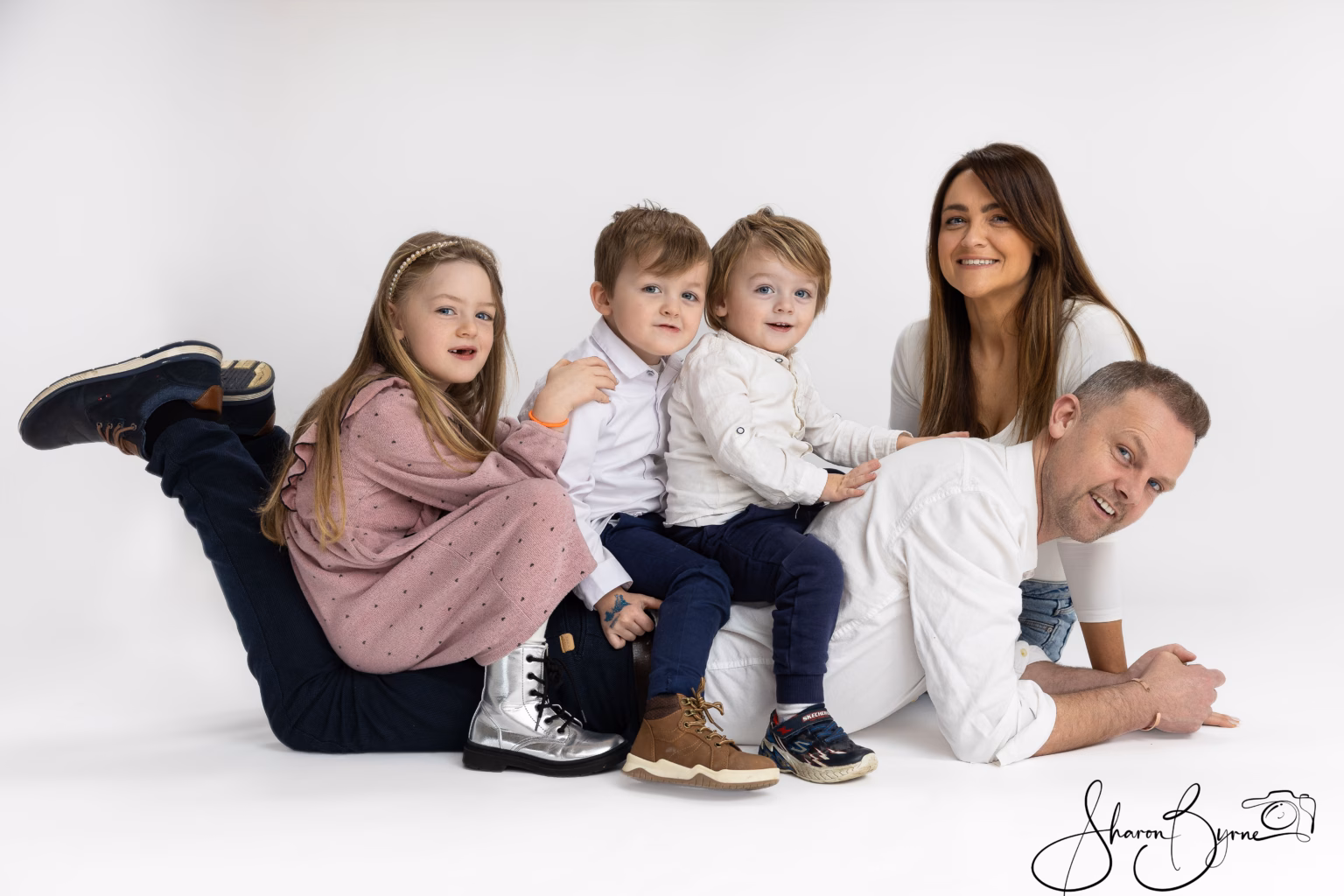 Happy family of five smiling during colour photoshoot at Meath studio