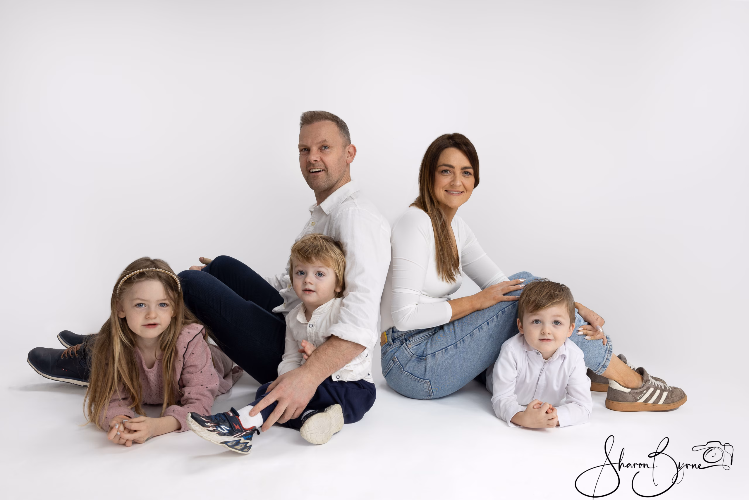 Happy family of five smiling during colour photoshoot at Meath studio
