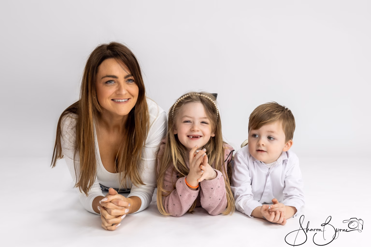 Happy family of five smiling during colour photoshoot at Meath studio