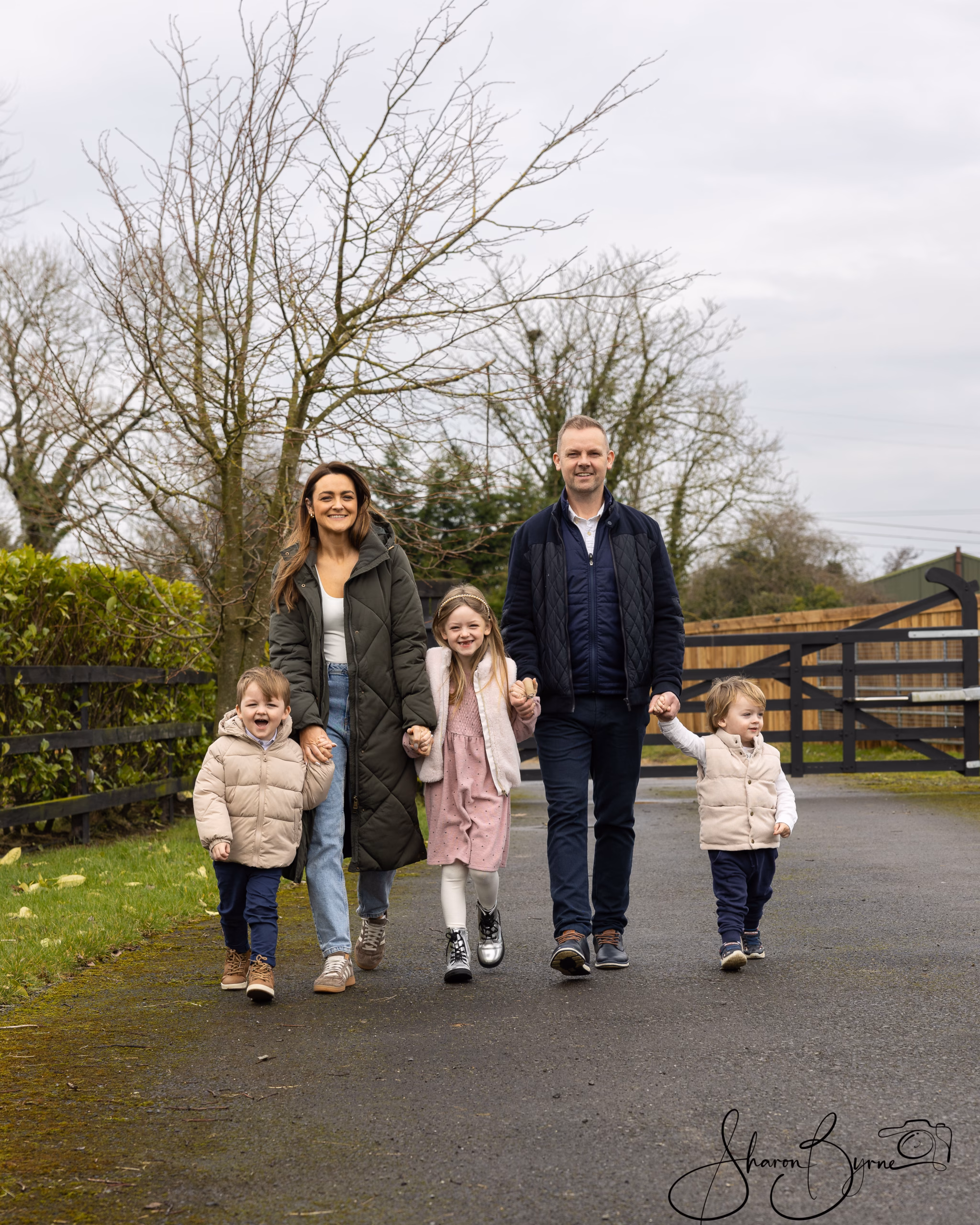 relaxed outdoor family photography with family walking and smiling enjoying the freedom of the outdoors