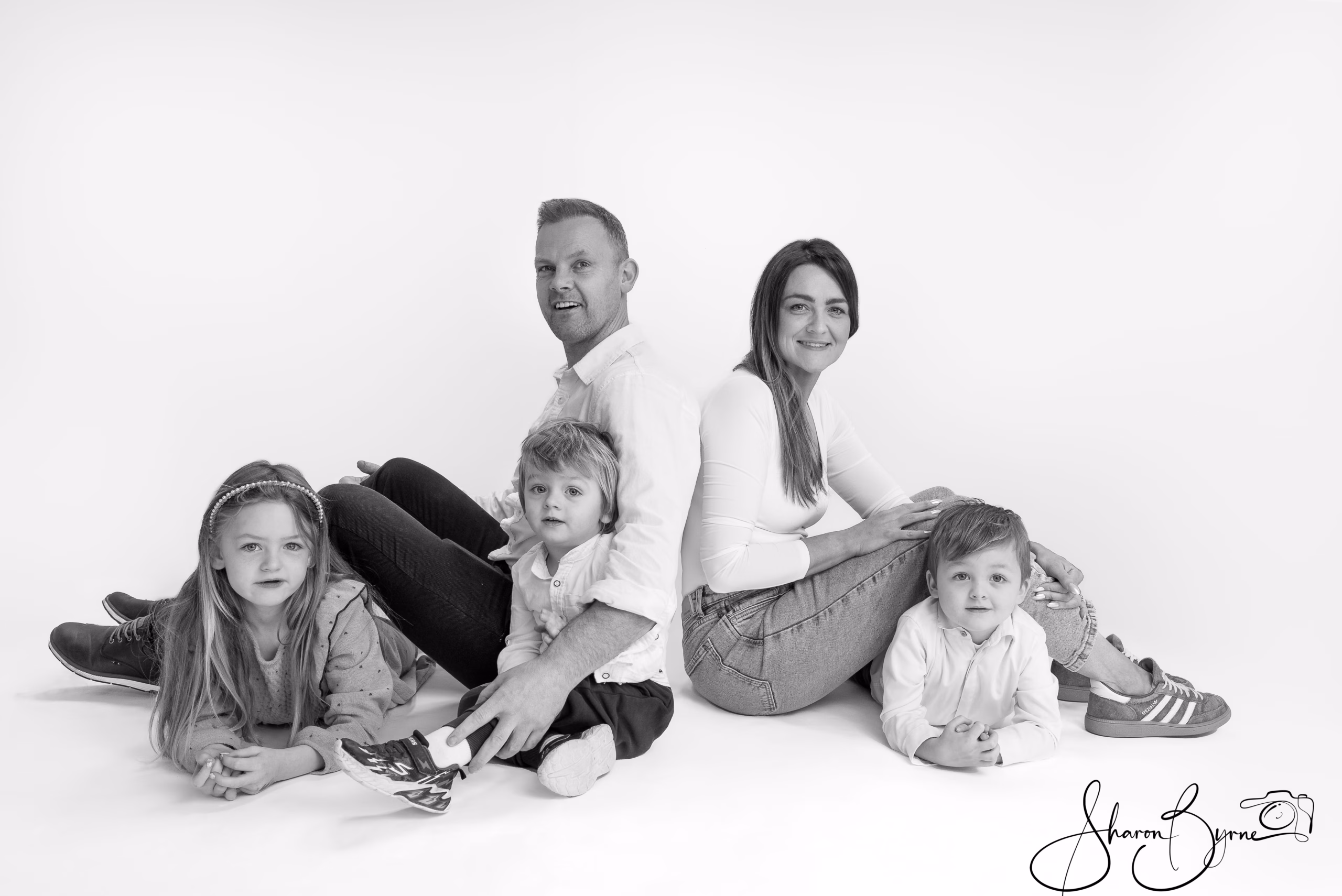 Black and white portrait, playfully presenting the love, fun and bond in a beautiful family.