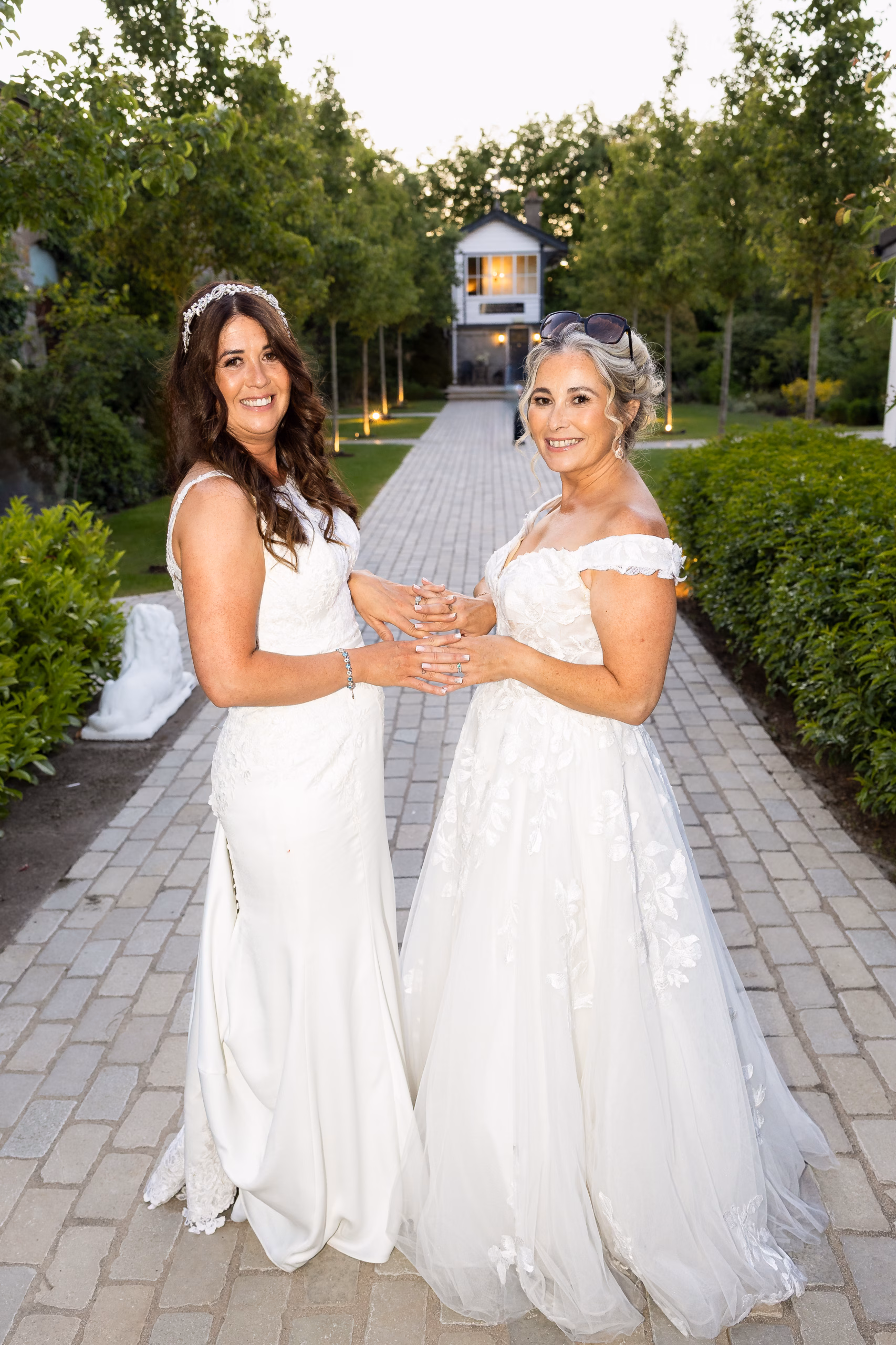 Brides Edel and Lorraine proudly showing their elegant bridal nails by Amy's Beauty Aesthetics, captured by wedding photographer Sharon Byrne Photography.
