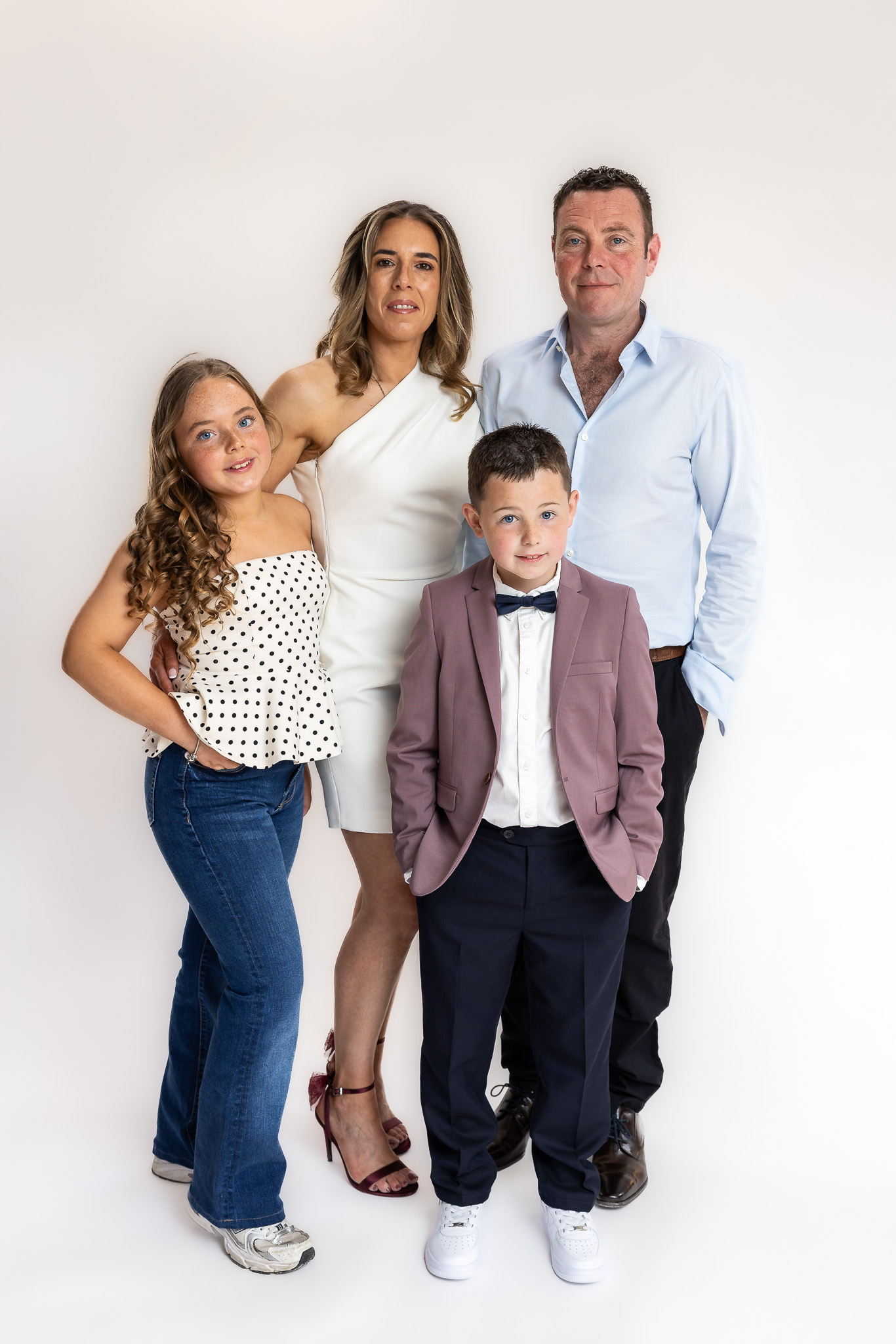 Modern family studio portrait of Sarah, Justin, Grace and Charlie photographed during a relaxed portrait session near Dublin.