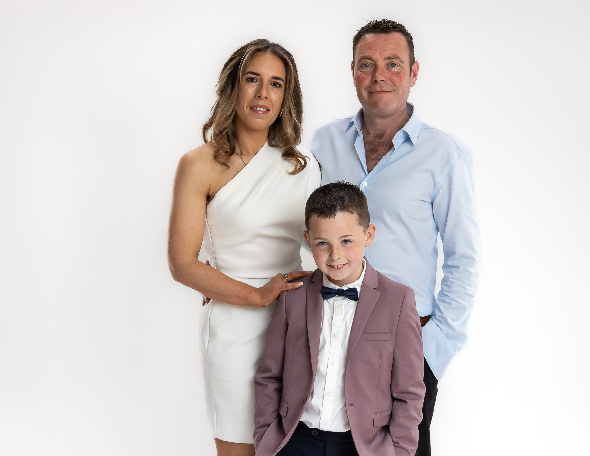 Relaxed family studio portrait of Sarah, Justin, and Charlie during a modern portrait photography session in Ireland.