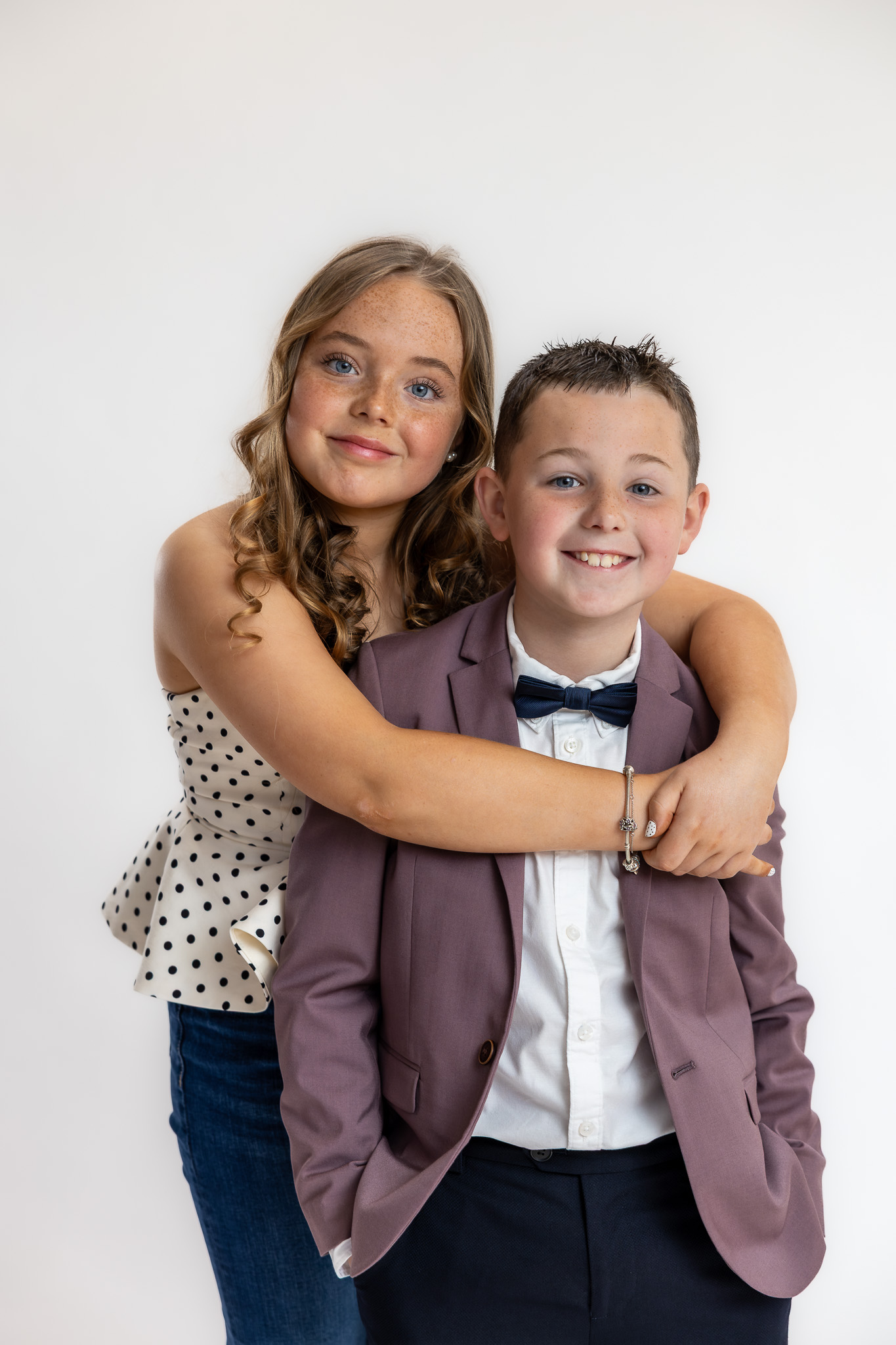Modern family portrait of Charlie and his sister photographed during a relaxed studio session in Ireland.
