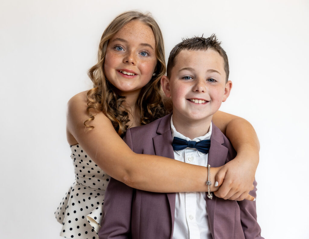 Relaxed sibling portrait with Charlie and his cousin during a natural family photography session in Ireland.